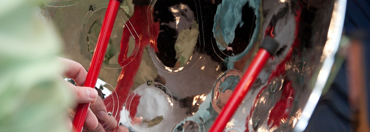 Conductor on stage with string musicians