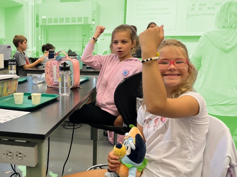 Decorative image of children doing a STEM lesson together