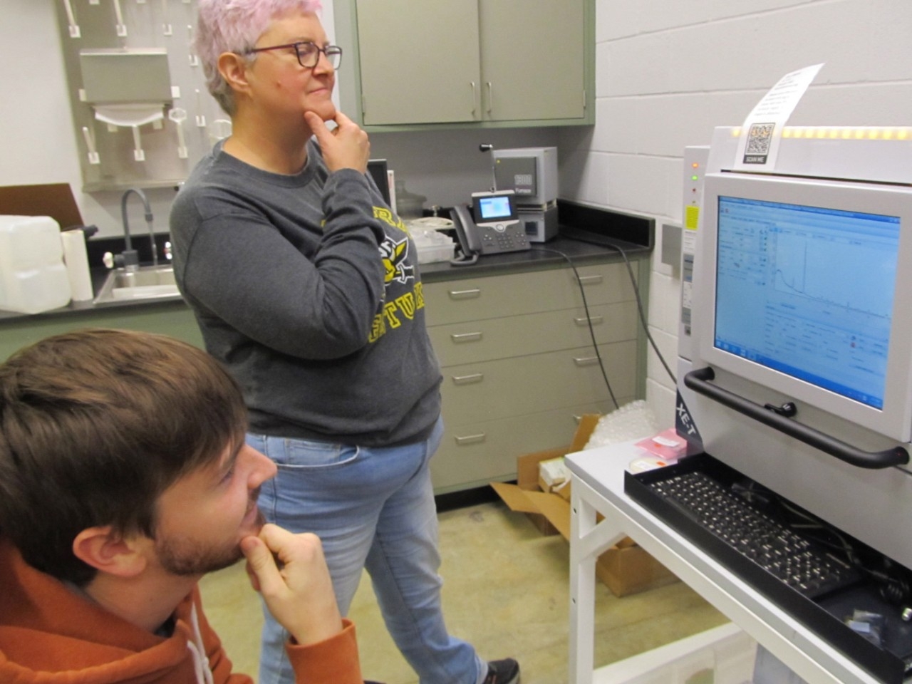 Biology students watching a demonstration.