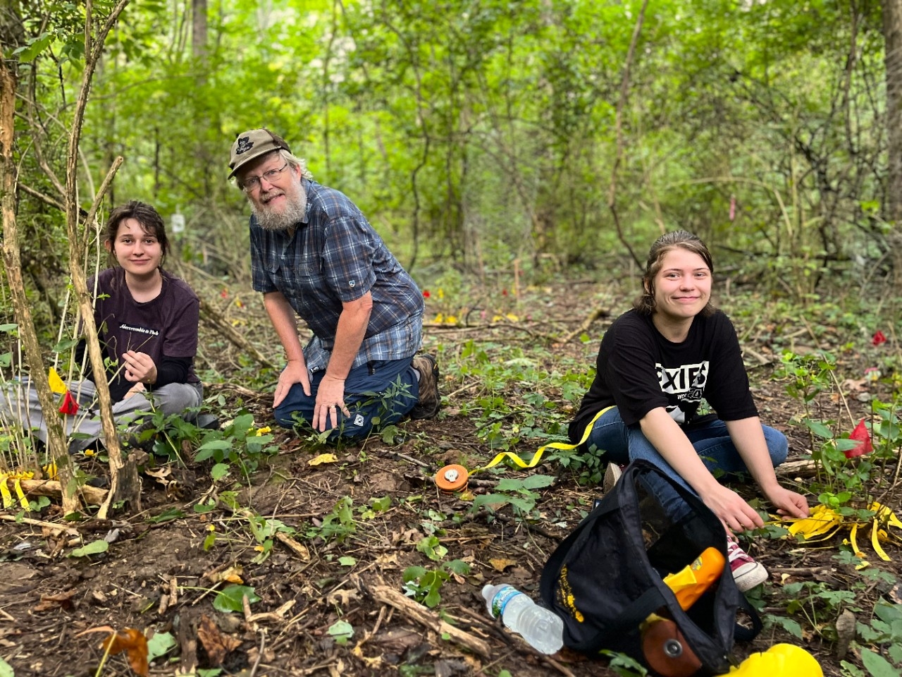 Faculty and students do summer research together in the woods.