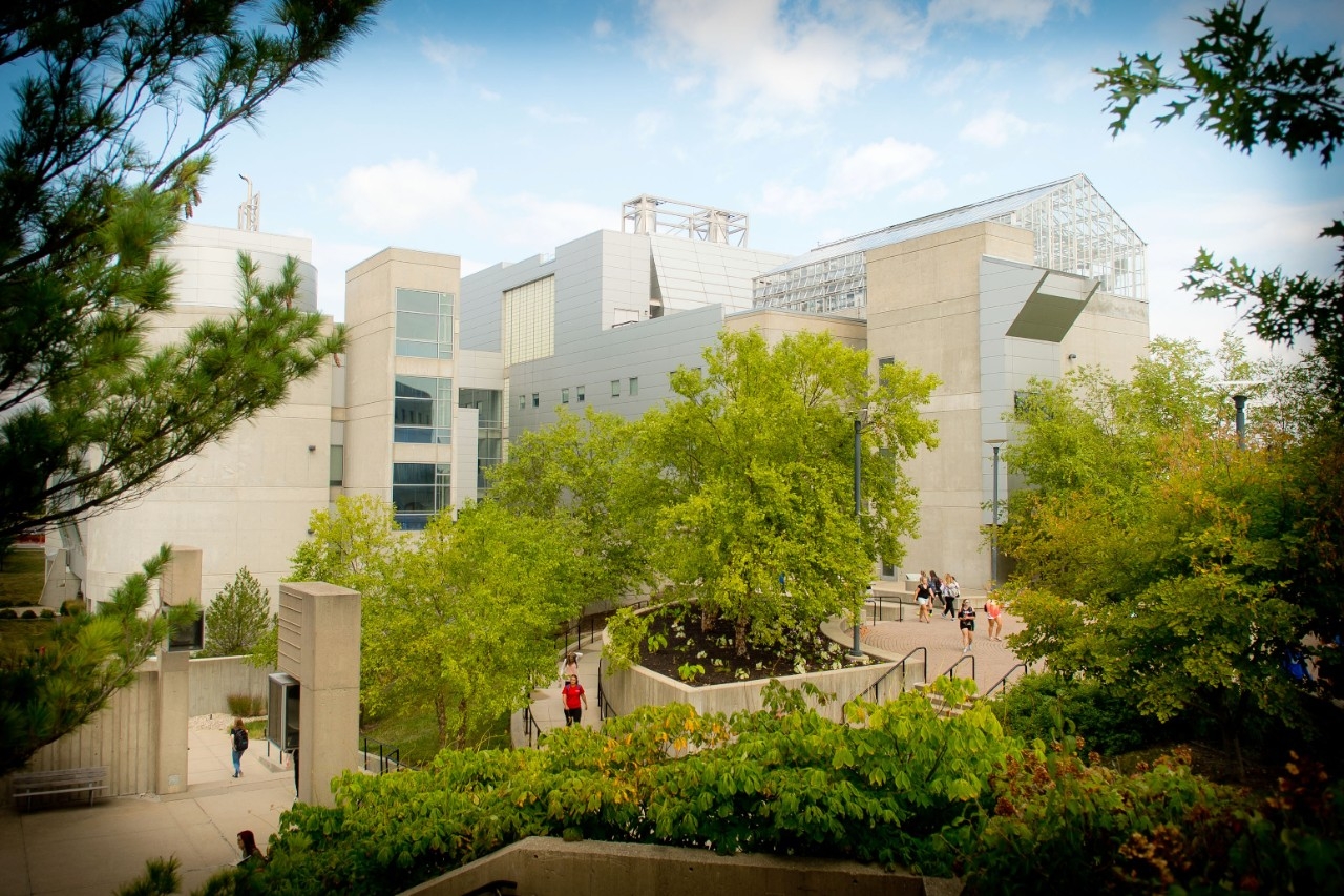 The exterior of NKU's Science Center, surrounded beautiful greenery on a sunny day
