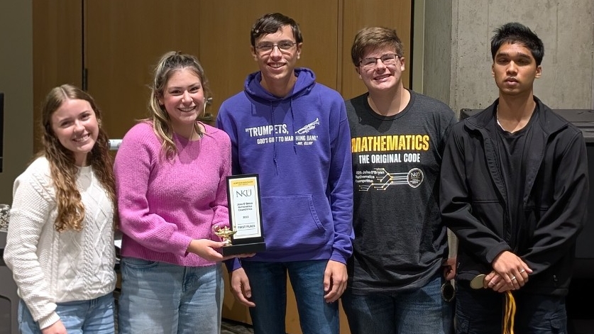 Ryle High School students pose for a picture with their award for overall varsity winner of the 2025 John O'Bryan Math competition.