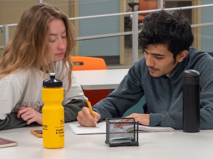 NKU student receives mathematics and statistics tutoring from a fellow student.