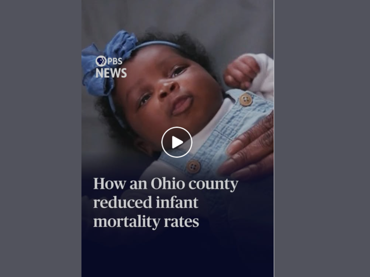 screenshot from the PBS video of baby laying on a blanket