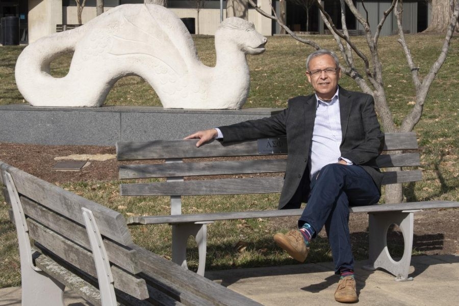 Leo Calderon sitting on bench on NKU campus