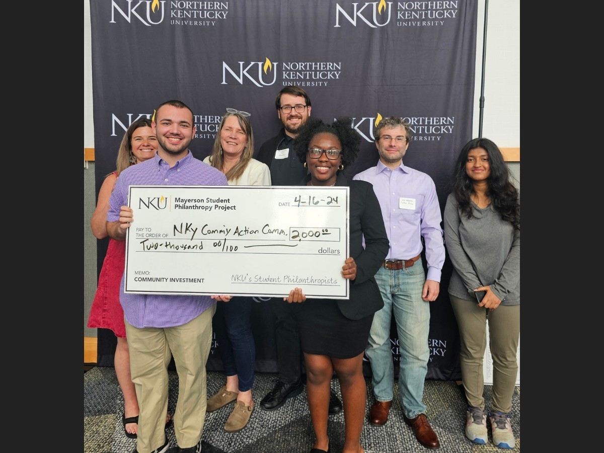 Untitled design - 1 PAD 621 students presenting big check to NKY Community Action Committee