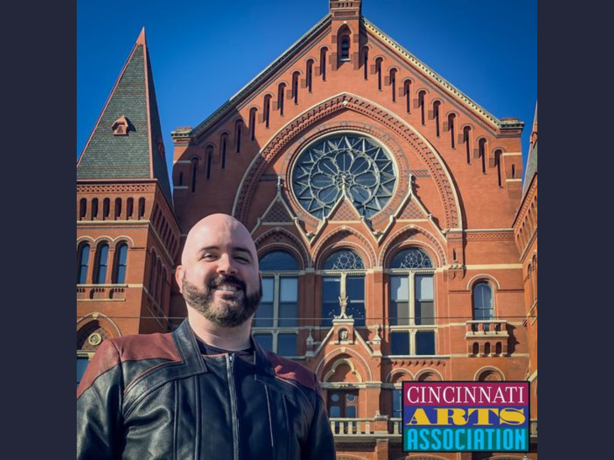 Untitled design - 1 Rick Endres standing in front of music hall
