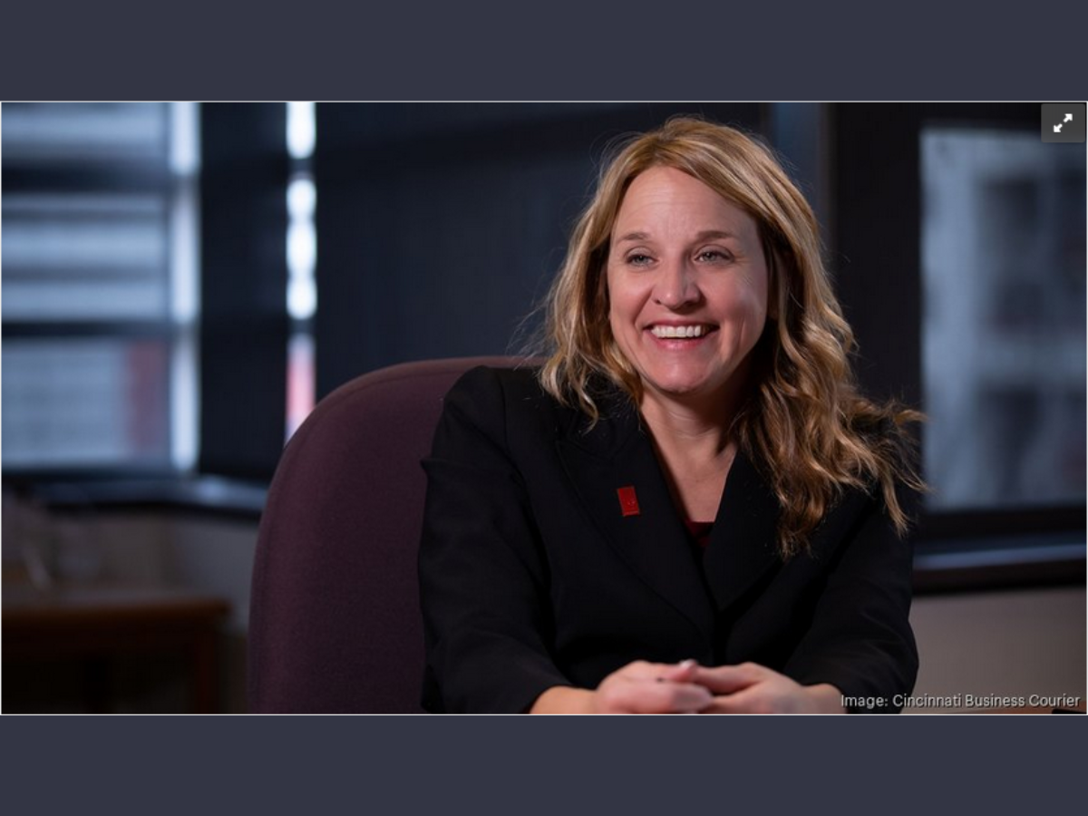 Untitled design - 1 Paula Brehm Heeger sitting on couch