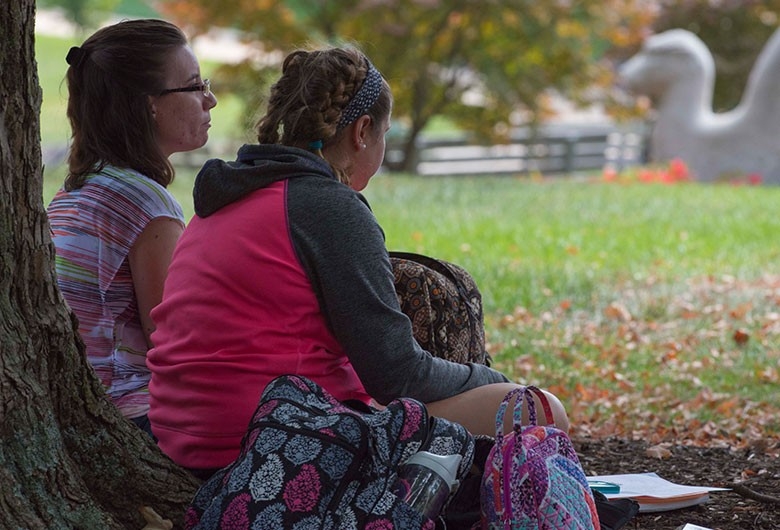 Students studying outdoors on NKU's campus