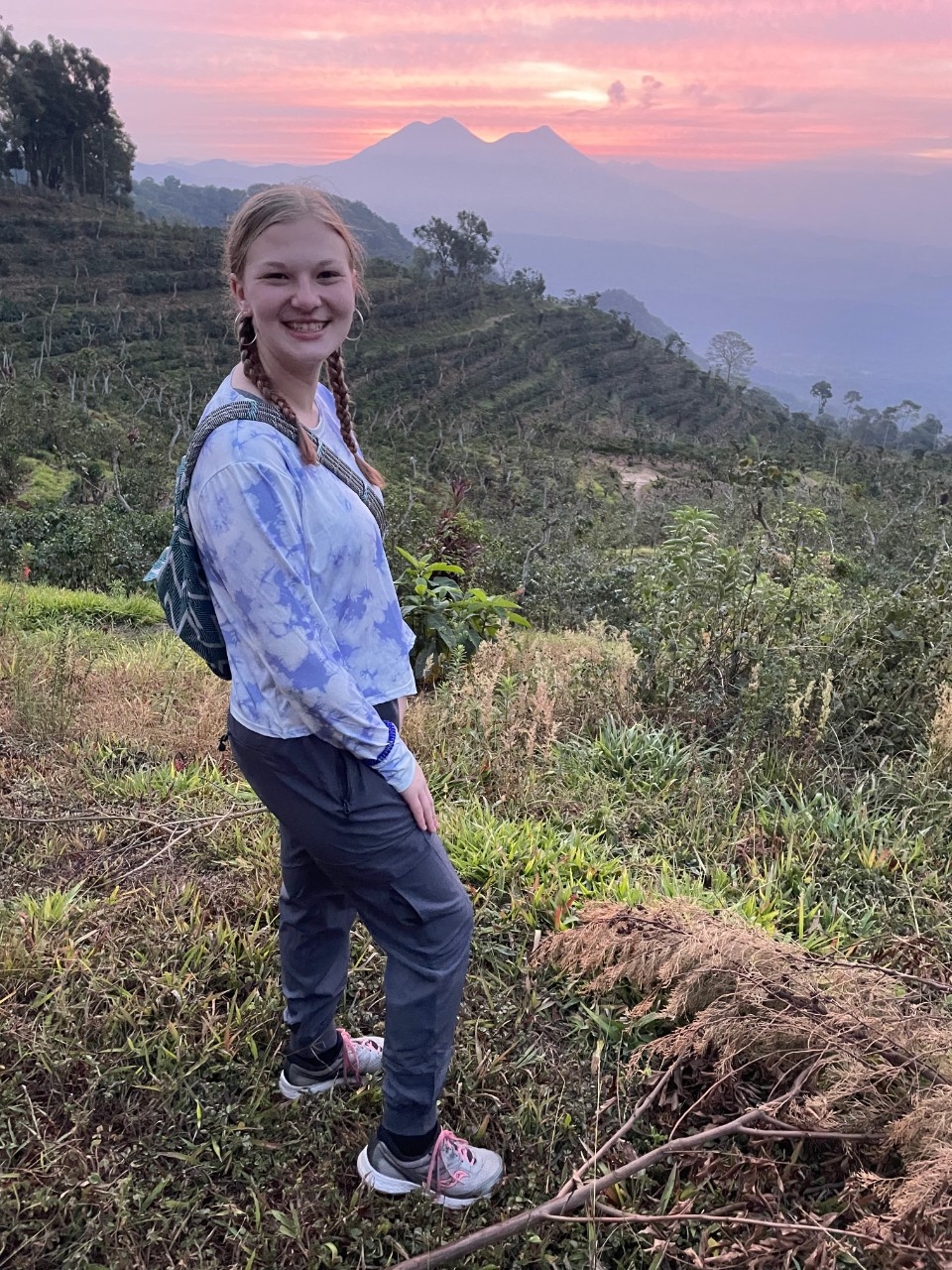 Samantha Mason on a mountainside at sunrise