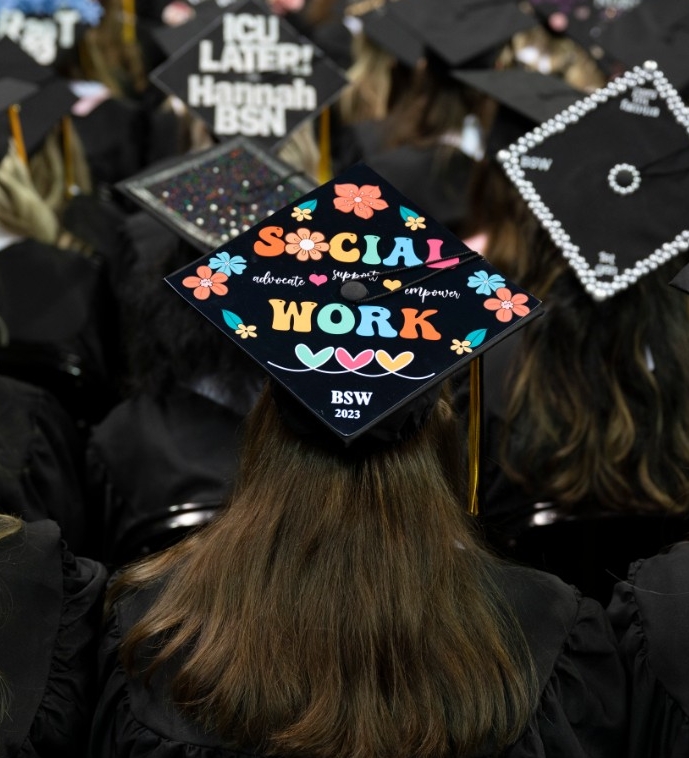 NKU BSW Graduate wearing cap that says "Social Work"