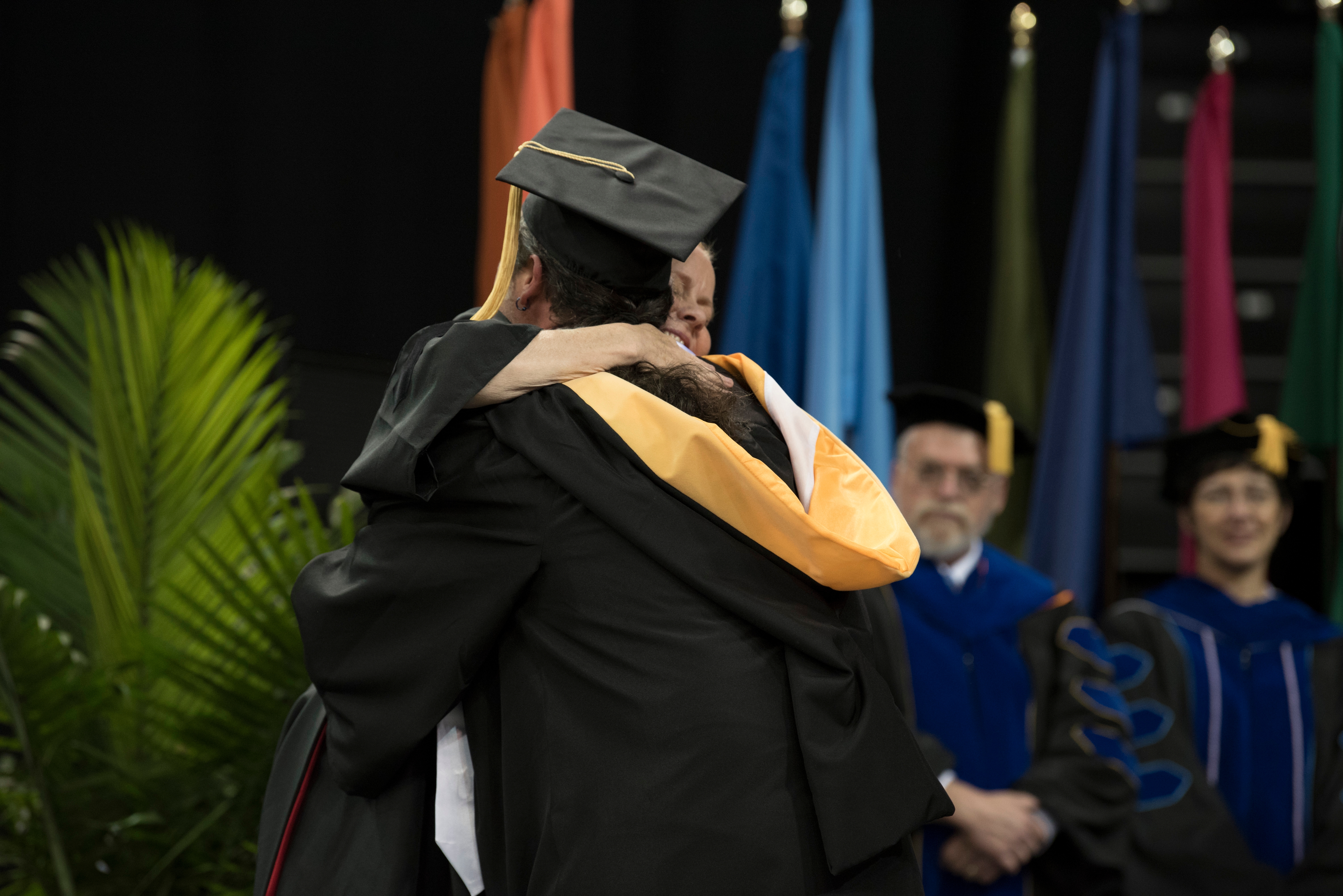MSW Graduate Hugging Professor
