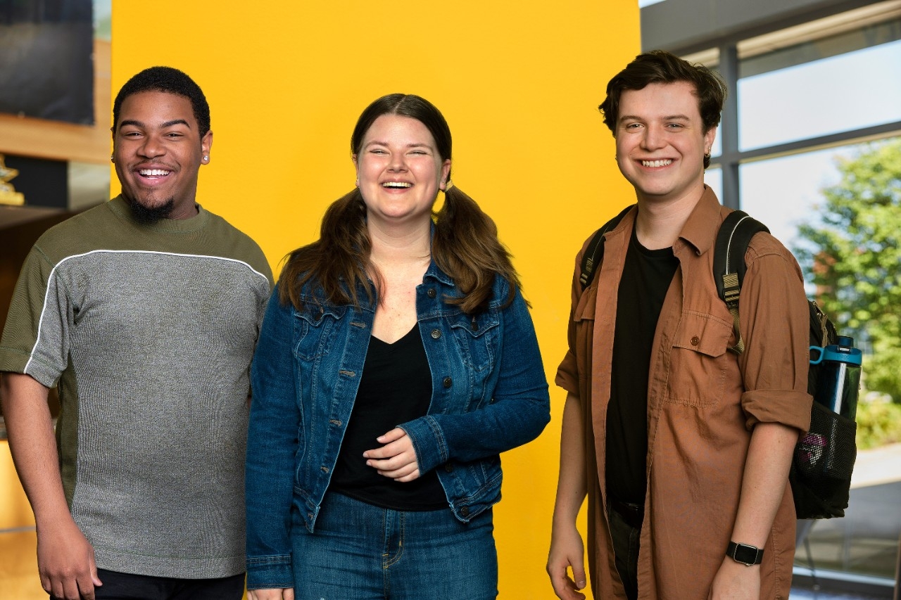 Three students standing together