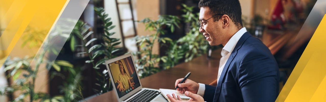 Business male taking an online class on laptop