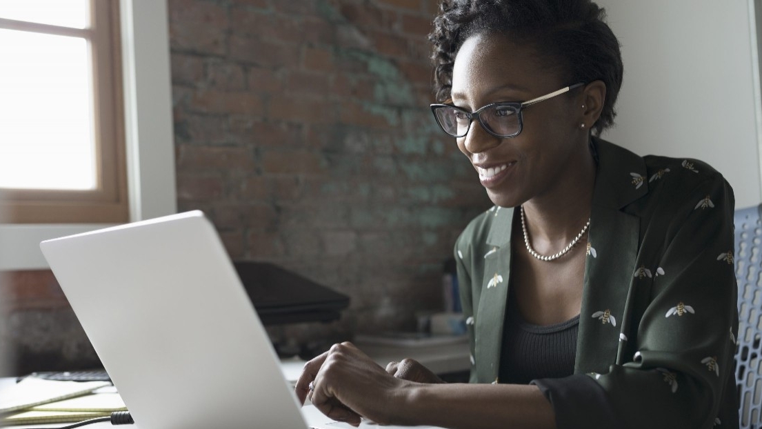 Woman at a laptop taking a class
