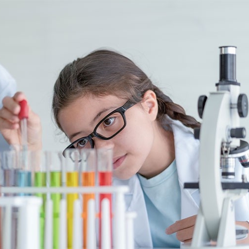 young scientist making experiments in glass tube in the laboratory room