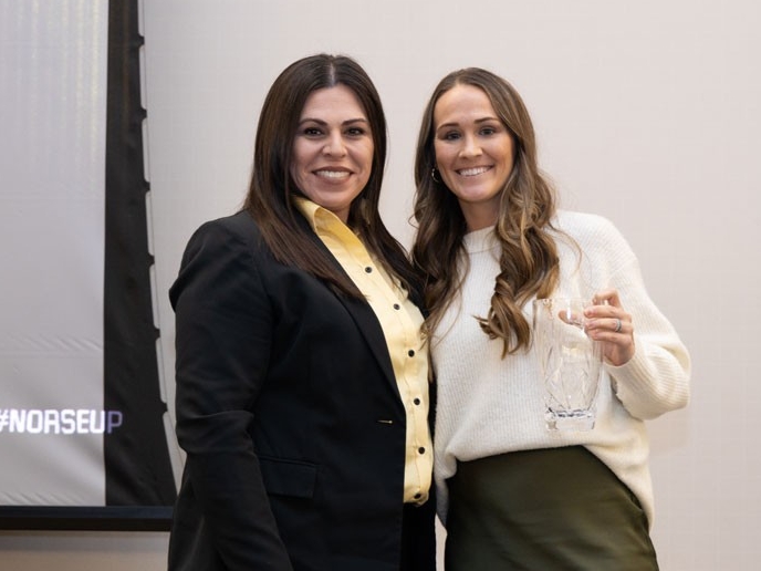 Amanda Mason Peyton holding award with Christina Roybal