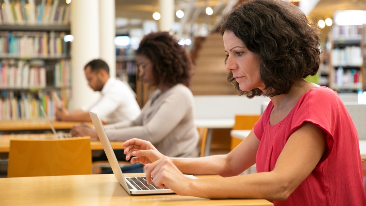 Woman studying with laptop