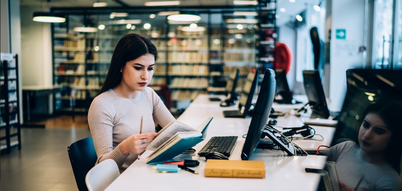 Female student at a laptop working on a micro-credential