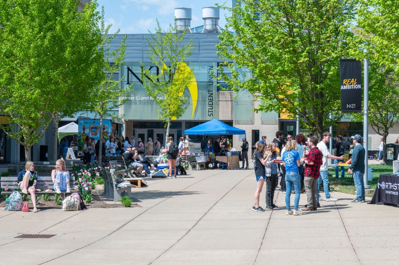 Students gather in between classes on the plaza between the Student Union and University Center buildings on Northern Kentucky University's Highland Heights campus. 